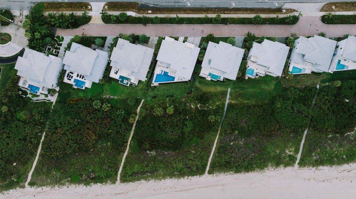 Stunning aerial view of beachfront homes with pools in Fort Pierce, Florida.