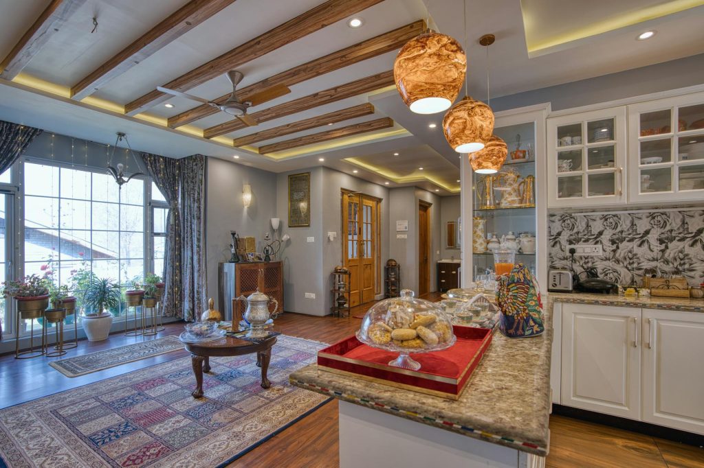 Explore the elegant and cozy living space featuring modern decor and warm lighting in Jammu and Kashmir.