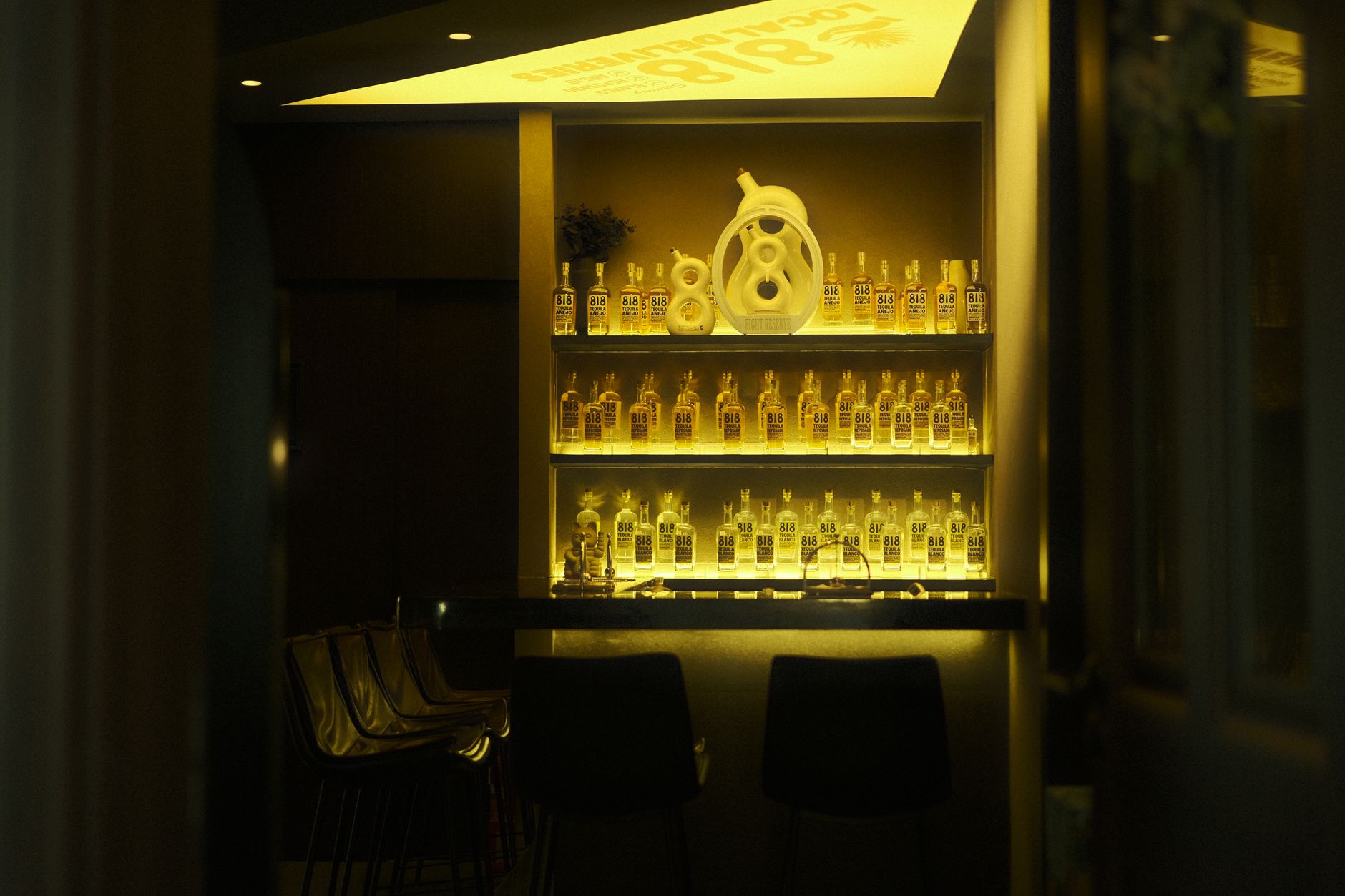 Colorful tequila bottles arranged in a row, showcasing traditional Mexican spirits.